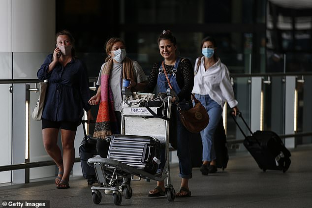 Travellers exit Heathrow Airport Terminal 2 today after Croatia, Austria and Trinidad and Tobago were added to the quarantine list