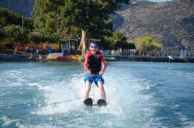 Happy days: Sarah¿s son Robert tries waterskiing, before moving on to a spot of canoeing