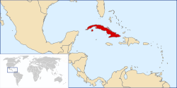 Political map of the Caribbean region with Cuba in red. An inset shows a world map with the main map