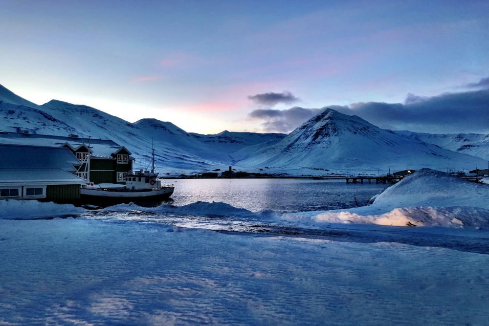 Iceland snowy scene with boat and water CR GreenSpot Travel